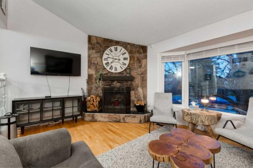 4 Cedarbrook Way Sw, Calgary, AB - Indoor Photo Showing Living Room With Fireplace