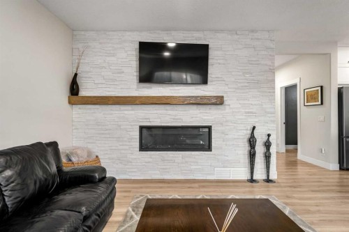 311 Chaparral Ravine View Se, Calgary, AB - Indoor Photo Showing Living Room With Fireplace