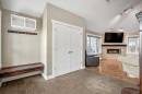 105 Lang Place, Okotoks, AB  - Indoor With Fireplace 