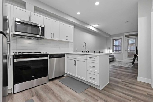 105-8355 19 Avenue Sw, Calgary, AB - Indoor Photo Showing Kitchen With Stainless Steel Kitchen With Upgraded Kitchen