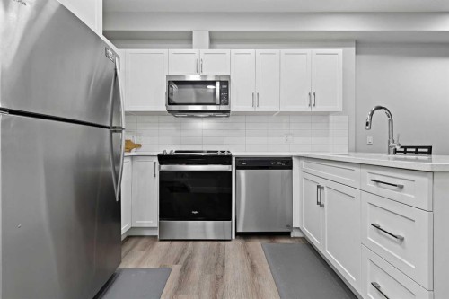105-8355 19 Avenue Sw, Calgary, AB - Indoor Photo Showing Kitchen With Stainless Steel Kitchen With Upgraded Kitchen