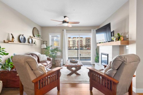 211-20 Seton Park Se, Calgary, AB - Indoor Photo Showing Living Room With Fireplace