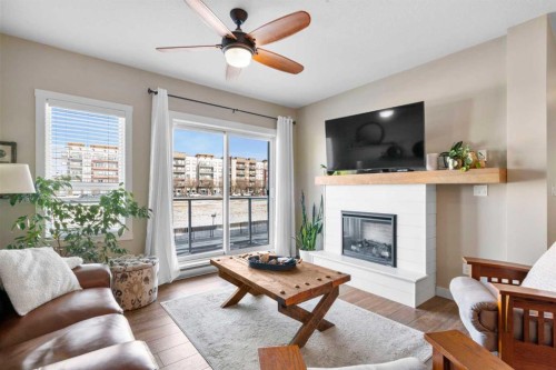 211-20 Seton Park Se, Calgary, AB - Indoor Photo Showing Living Room With Fireplace