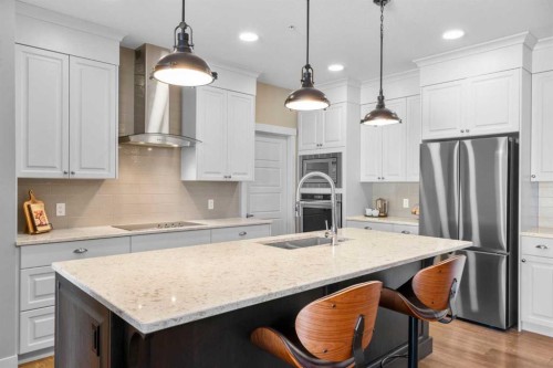 211-20 Seton Park Se, Calgary, AB - Indoor Photo Showing Kitchen With Stainless Steel Kitchen With Double Sink With Upgraded Kitchen