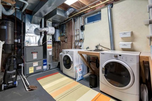 8 Deerwood Road Se, Calgary, AB - Indoor Photo Showing Laundry Room