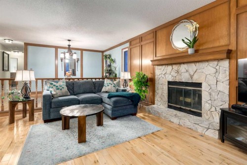 8 Deerwood Road Se, Calgary, AB - Indoor Photo Showing Living Room With Fireplace