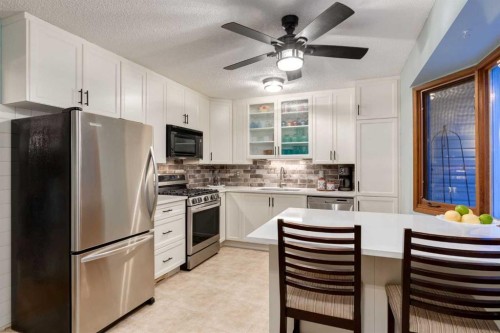 8 Deerwood Road Se, Calgary, AB - Indoor Photo Showing Kitchen With Upgraded Kitchen