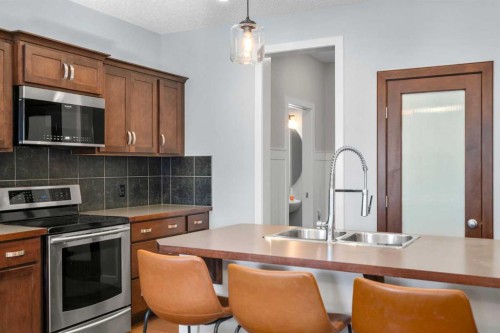 9 Sage Valley Park Nw, Calgary, AB - Indoor Photo Showing Kitchen With Stainless Steel Kitchen With Double Sink