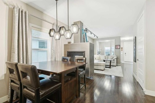2231 26 Avenue Sw, Calgary, AB - Indoor Photo Showing Dining Room With Fireplace
