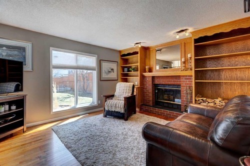 116 Macewan Ridge Close Nw, Calgary, AB - Indoor Photo Showing Living Room With Fireplace