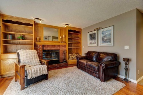 116 Macewan Ridge Close Nw, Calgary, AB - Indoor Photo Showing Living Room With Fireplace