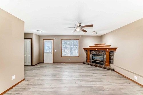 11-33 Stonegate Drive Nw, Airdrie, AB - Indoor Photo Showing Other Room With Fireplace