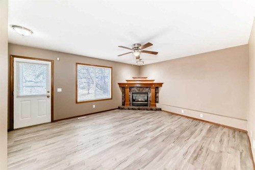 11-33 Stonegate Drive Nw, Airdrie, AB - Indoor With Fireplace