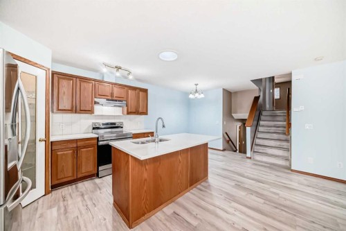 11-33 Stonegate Drive Nw, Airdrie, AB - Indoor Photo Showing Kitchen With Double Sink