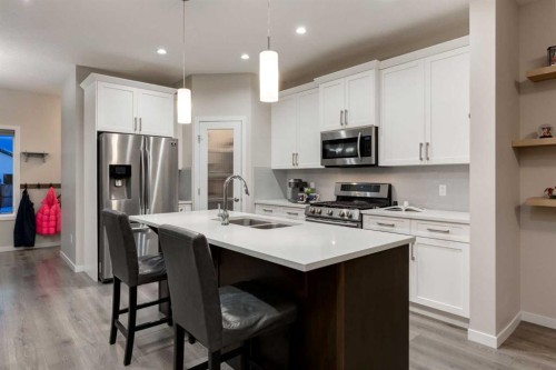 123 Drake Landing Loop, Okotoks, AB - Indoor Photo Showing Kitchen With Double Sink With Upgraded Kitchen
