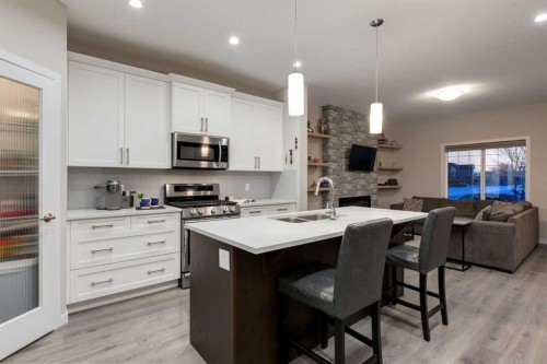 123 Drake Landing Loop, Okotoks, AB - Indoor Photo Showing Kitchen With Double Sink With Upgraded Kitchen