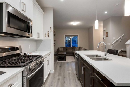123 Drake Landing Loop, Okotoks, AB - Indoor Photo Showing Kitchen With Double Sink With Upgraded Kitchen