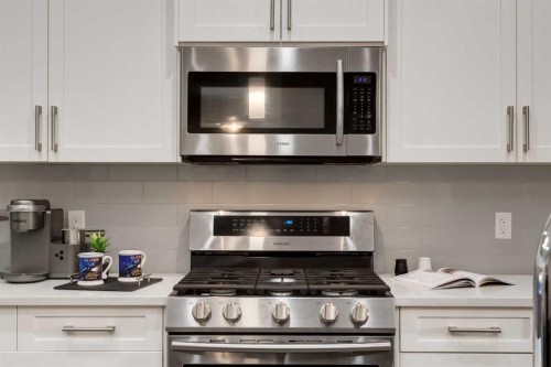 123 Drake Landing Loop, Okotoks, AB - Indoor Photo Showing Kitchen With Upgraded Kitchen