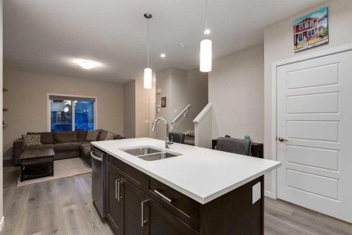 123 Drake Landing Loop, Okotoks, AB - Indoor Photo Showing Kitchen With Double Sink