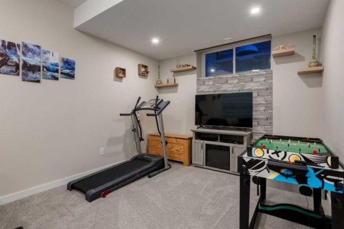 123 Drake Landing Loop, Okotoks, AB - Indoor Photo Showing Gym Room