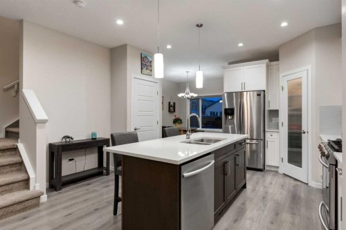 123 Drake Landing Loop, Okotoks, AB - Indoor Photo Showing Kitchen With Double Sink With Upgraded Kitchen
