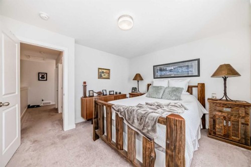 1302 Jumping Pound Common, Cochrane, AB - Indoor Photo Showing Bedroom