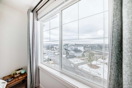 1302 Jumping Pound Common, Cochrane, AB - Indoor Photo Showing Other Room