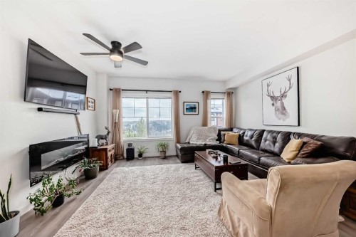 1302 Jumping Pound Common, Cochrane, AB - Indoor Photo Showing Living Room