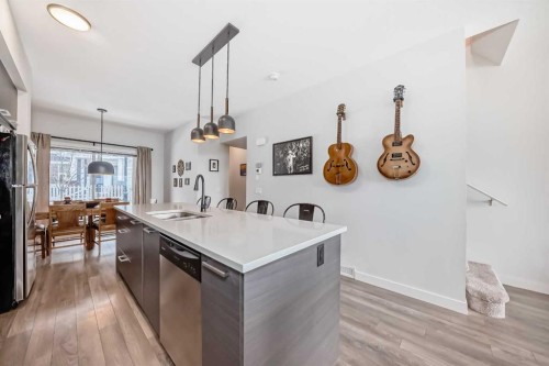 1302 Jumping Pound Common, Cochrane, AB - Indoor Photo Showing Kitchen