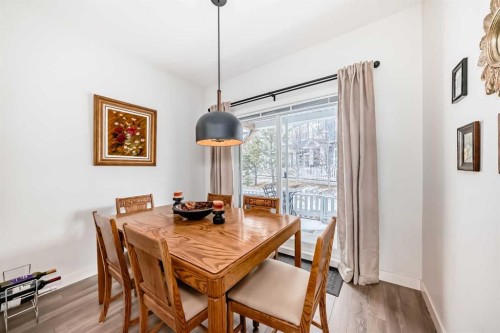 1302 Jumping Pound Common, Cochrane, AB - Indoor Photo Showing Dining Room