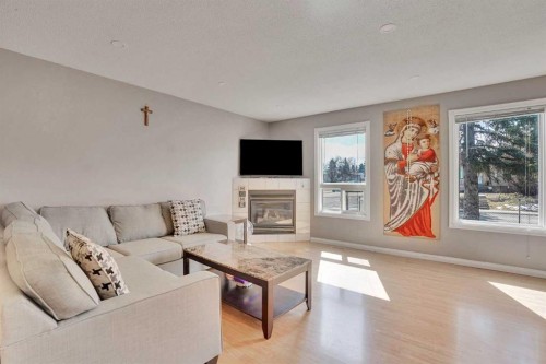 1004 Penrith Crescent Se, Calgary, AB - Indoor Photo Showing Living Room With Fireplace