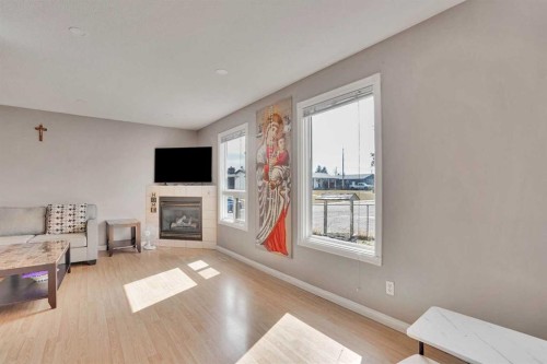 1004 Penrith Crescent Se, Calgary, AB - Indoor Photo Showing Living Room With Fireplace