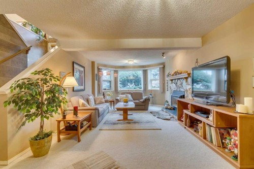 8 Douglas Woods View Se, Calgary, AB - Indoor Photo Showing Other Room With Fireplace