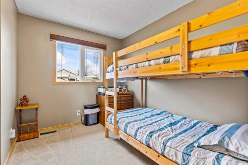 302 Stuart Street, Blackie, AB - Indoor Photo Showing Bedroom