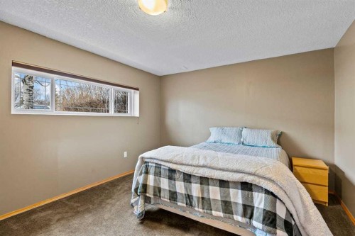 302 Stuart Street, Blackie, AB - Indoor Photo Showing Bedroom