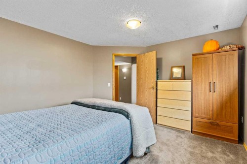 302 Stuart Street, Blackie, AB - Indoor Photo Showing Bedroom