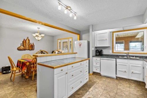 302 Stuart Street, Blackie, AB - Indoor Photo Showing Kitchen With Double Sink