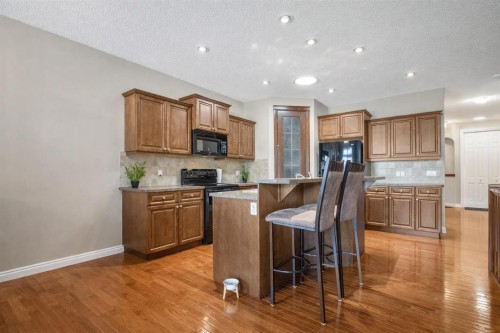 1907 Riverside Drive Nw, High River, AB - Indoor Photo Showing Living Room With Fireplace