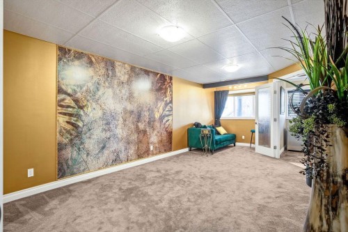 1907 Riverside Drive Nw, High River, AB - Indoor Photo Showing Bedroom