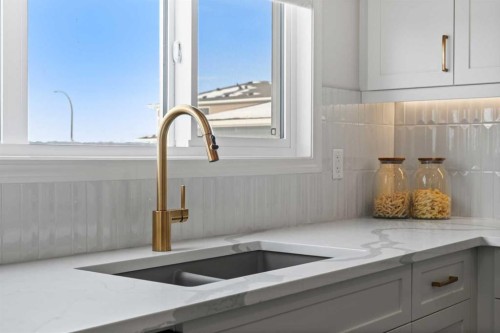 135 Huxland Road Ne, Calgary, AB - Indoor Photo Showing Kitchen With Double Sink