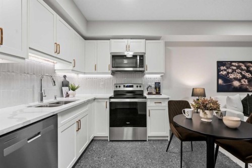 135 Huxland Road Ne, Calgary, AB - Indoor Photo Showing Kitchen With Double Sink
