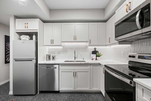 135 Huxland Road Ne, Calgary, AB - Indoor Photo Showing Kitchen With Double Sink