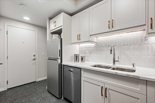 135 Huxland Road Ne, Calgary, AB - Indoor Photo Showing Kitchen With Double Sink