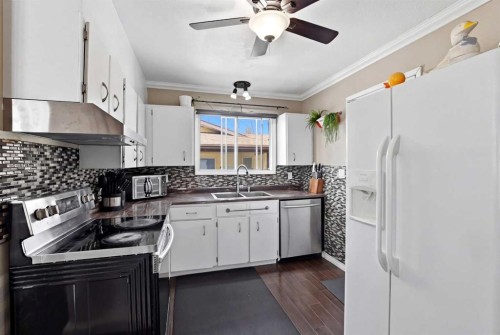 5218 Silverthorn Road, Olds, AB - Indoor Photo Showing Kitchen With Double Sink
