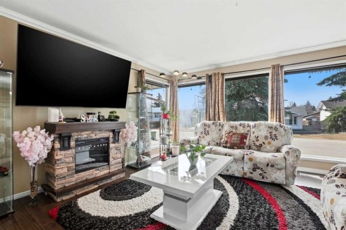5218 Silverthorn Road, Olds, AB - Indoor Photo Showing Living Room With Fireplace