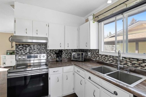 5218 Silverthorn Road, Olds, AB - Indoor Photo Showing Kitchen With Double Sink