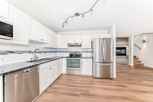 155 Prominence Heights Sw, Calgary, AB - Indoor Photo Showing Kitchen With Stainless Steel Kitchen With Double Sink With Upgraded Kitchen