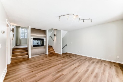 155 Prominence Heights Sw, Calgary, AB - Indoor With Fireplace