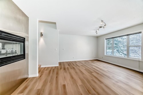 155 Prominence Heights Sw, Calgary, AB - Indoor With Fireplace