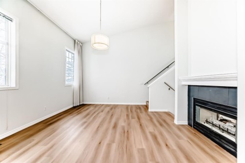 155 Prominence Heights Sw, Calgary, AB - Indoor With Fireplace